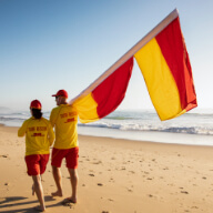 Lifesavers carrying flags